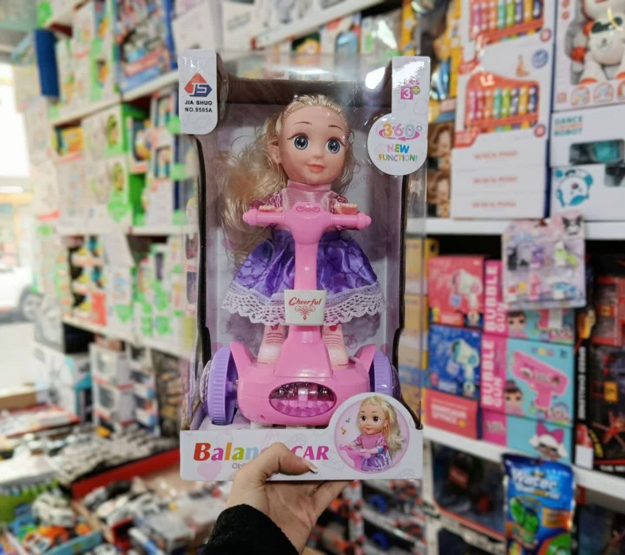 عروسک اسکوتر سوار باطری خور کیوت صورتی